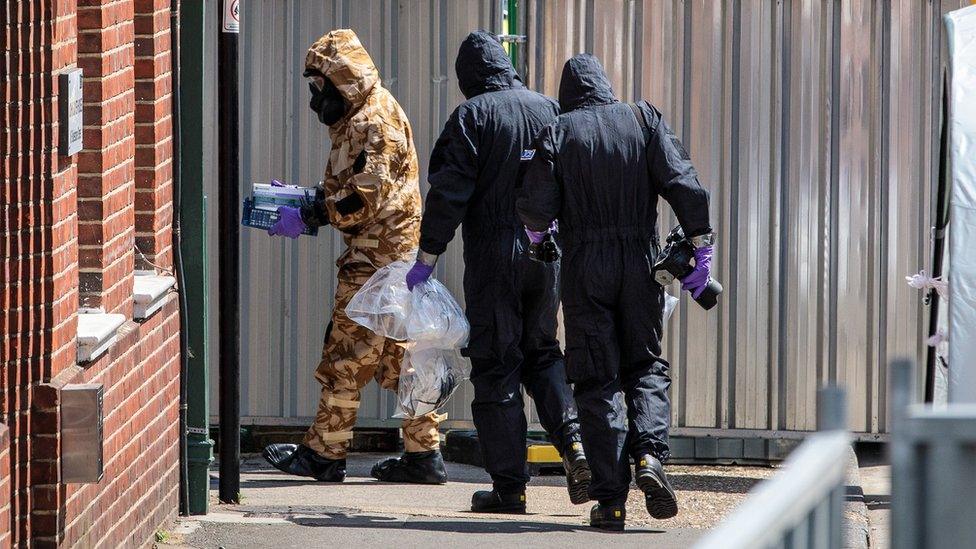 People in hazmat suits enter a property in Amesbury in Wiltshire after Novichok was found there