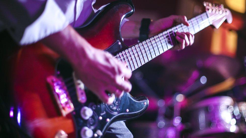 Musician playing guitar