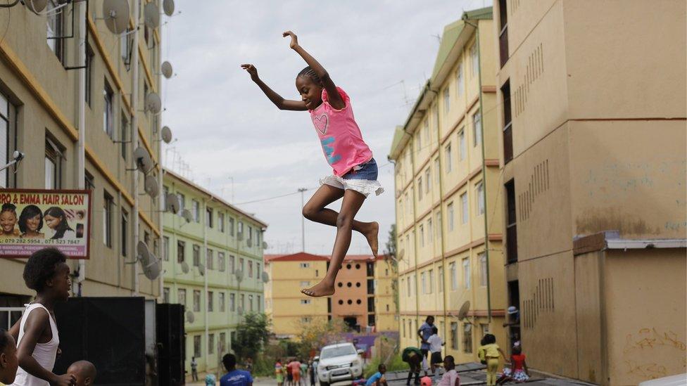 Children jump on a trampoline at the Alexandra Trampoline Club in the township of Alexandra in Johannesburg, South Africa