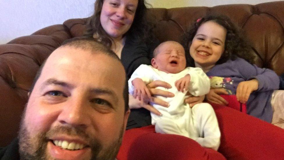 Kayleigh and Colin Griffiths with their one-day-old daughter Pippa and her sister Brooke