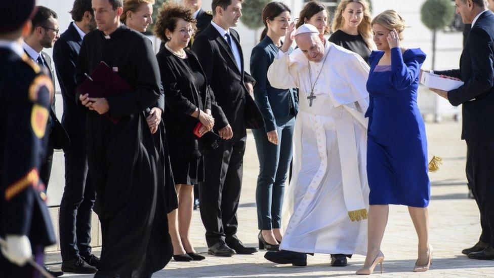 Slovak President Zuzana Caputova (R) welcomes Pope Francis at the Presidential Palace in Bratislava