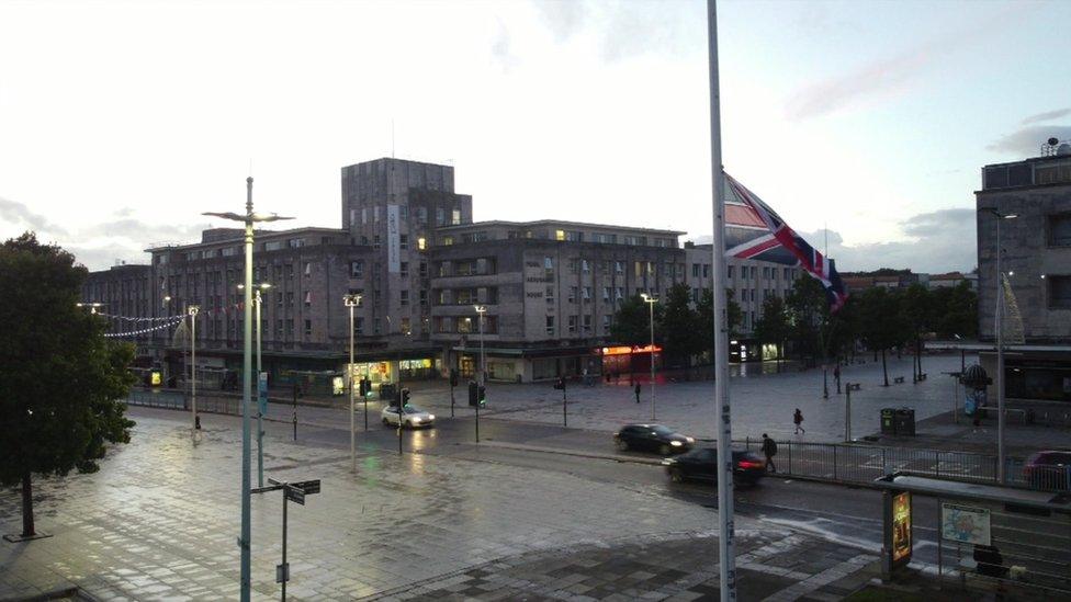 A flag flying half mast