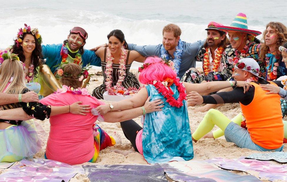 Prince Harry, Duke of Sussex and Meghan, Duchess of Sussex talk to members of OneWave, an awareness group for mental health and wellbeing at South Bondi Beach on October 19, 2018 in Sydney, Australia