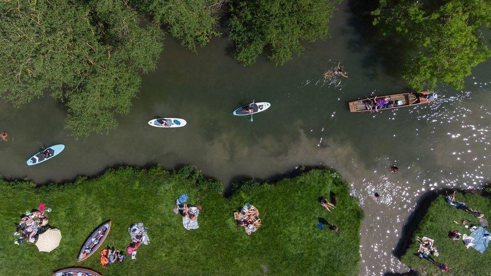 people-on-punts-and-kayaks-near Cambridge