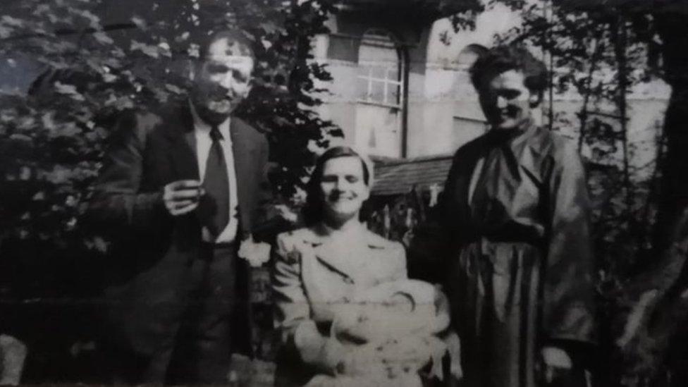 Baby Anna with her parents and her Godmother on her Christening day