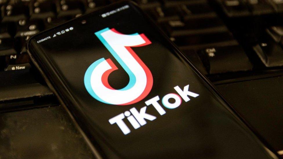 TikTok logo on a phone