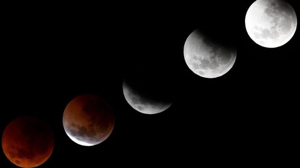 Various phases of the moon during a lunar eclipse in Sydney, Australia, 28 July 2018.