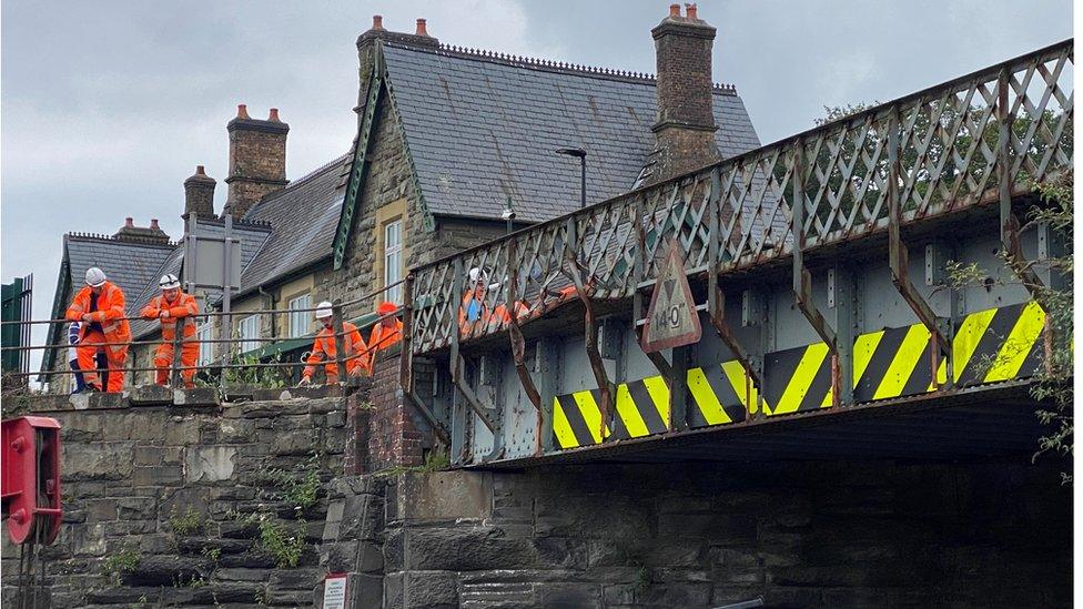 engineers assessing the bridge