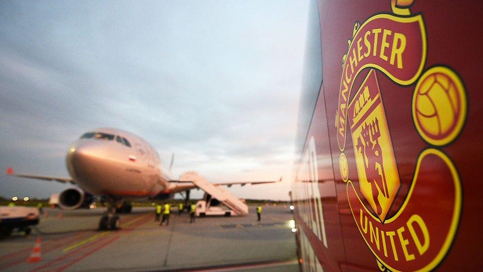 Manchester United Crest on side of bus