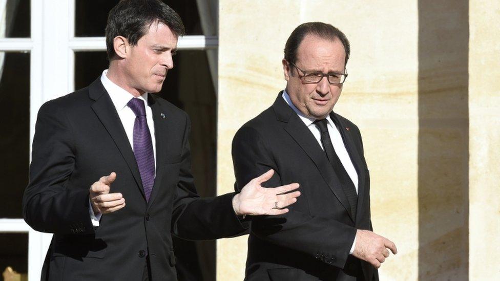 French Prime Minister Manuel Valls talks to President Francois Hollande