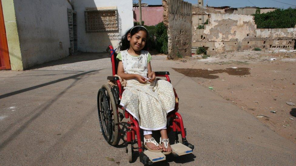 Khadija in her wheelchair