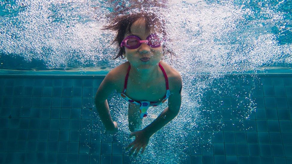 child in swimming pool