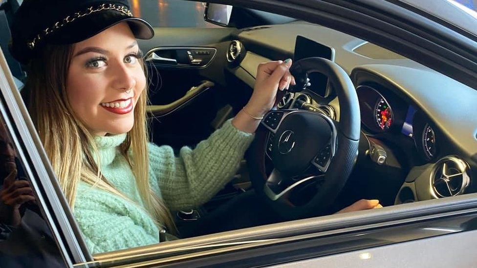 Jennie Berry at the wheel of her new car