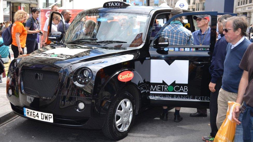 People around taxi
