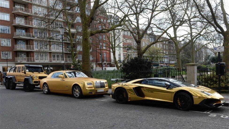 Fleet of gold cars in Knightsbridge