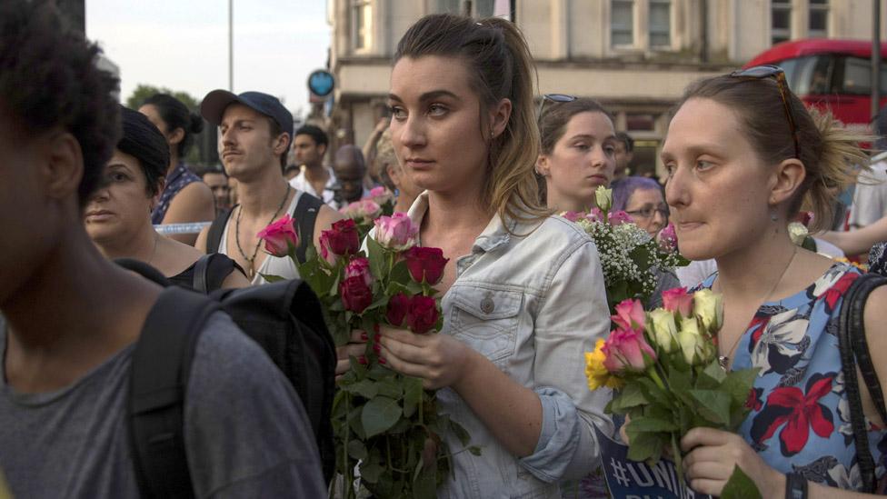 People waiting with roses