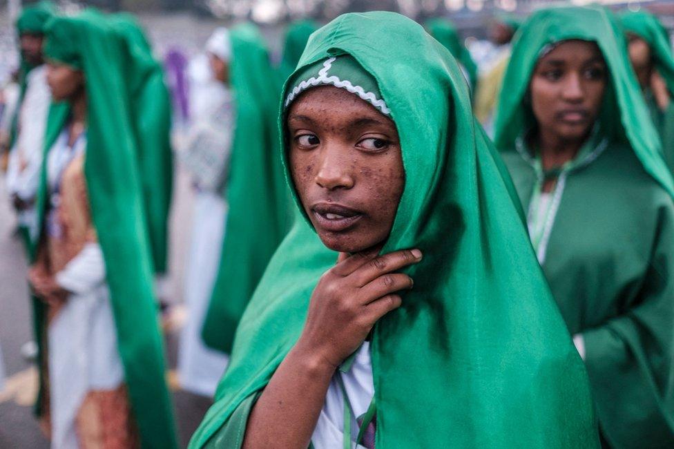 People dressed in green