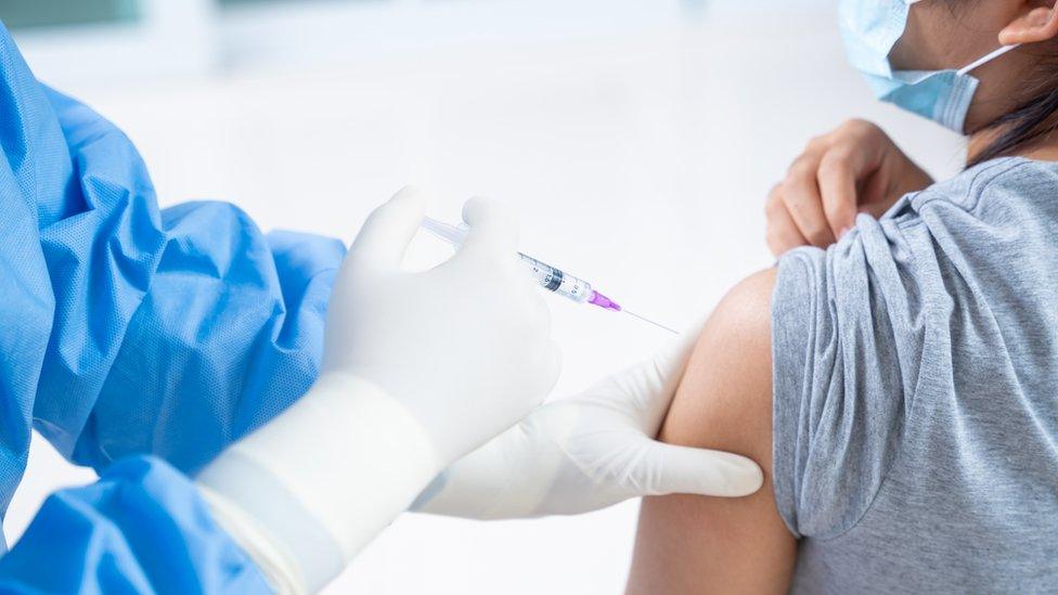 Teenage patient receiving vaccine