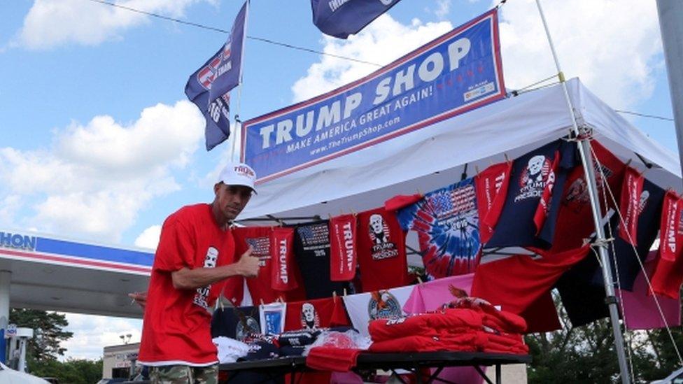 Brad Penton, a vendor from New Orleans, sells Republican US presidential candidate Donald Trump items in St. Clairsville