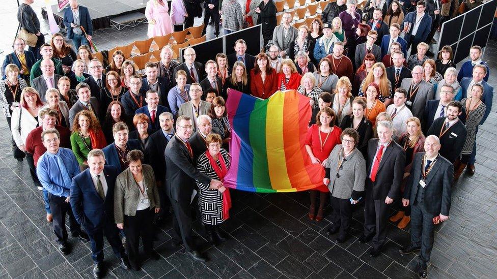 Welsh Assembly members with LGBT rainbow flag