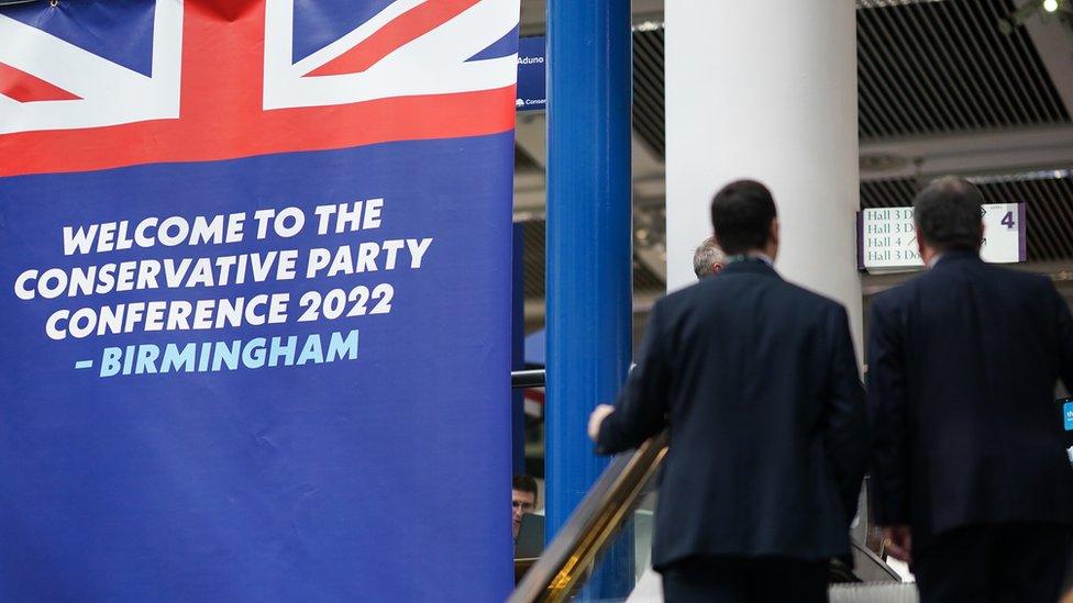 Shot behind people at Tory party conference