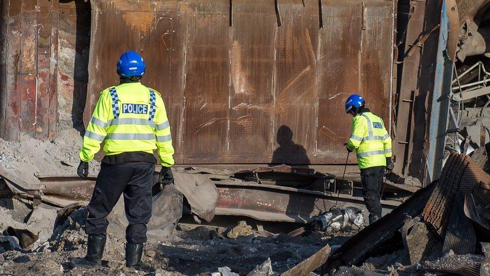 Police dogs search Didcot power station wreckage