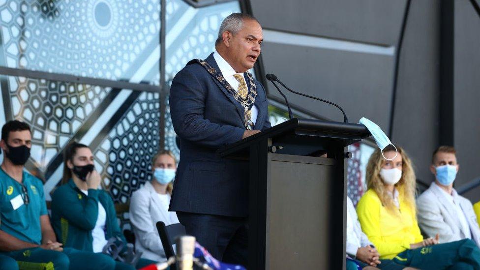 Tom Tate speaking at a lectern