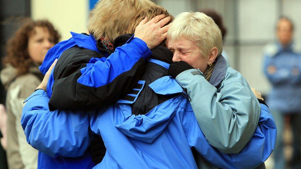 Residents of Cockermouth console each other