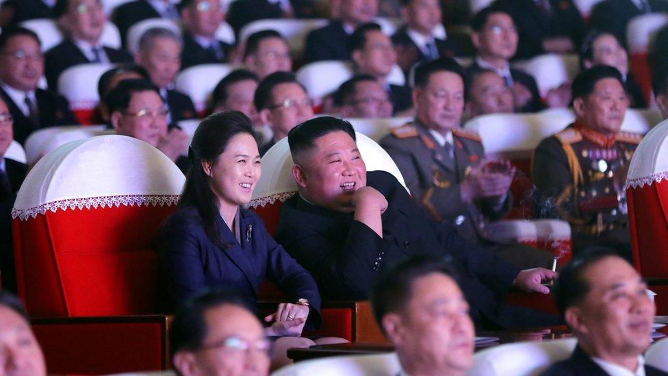 North Korean leader Kim Jong Un and his wife Ri Sol Ju watch a performance that commemorated the Day of the Shining Star