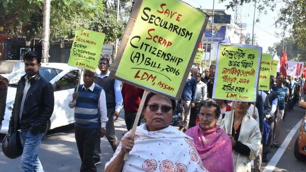 Activists of the Left Democratic Manch alliance hold placards as they take part in protest rally in protest against Citizenship Amendment Bill 2016, which will provide citizenship or stay rights to minorities from Bangladesh, Pakistan and Afghanistan in India, in Guwahati on January 7, 2019.