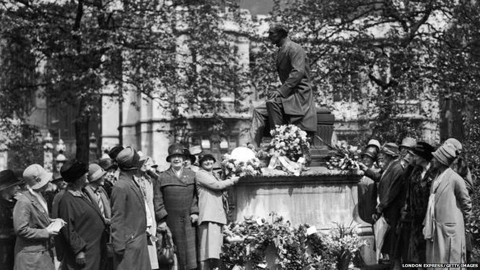 Women paying tribute to Mill in 1928, when women were given the vote