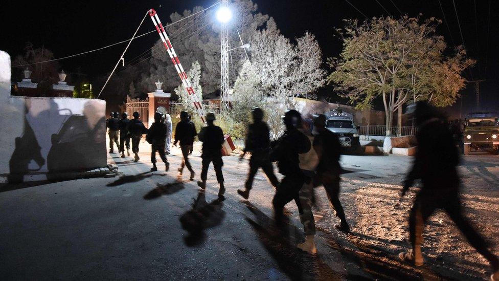 Pakistani army soldiers walk in a line at the Balochistan Police Training College in Quetta on October 24, 2016, after militants attacked the police academy