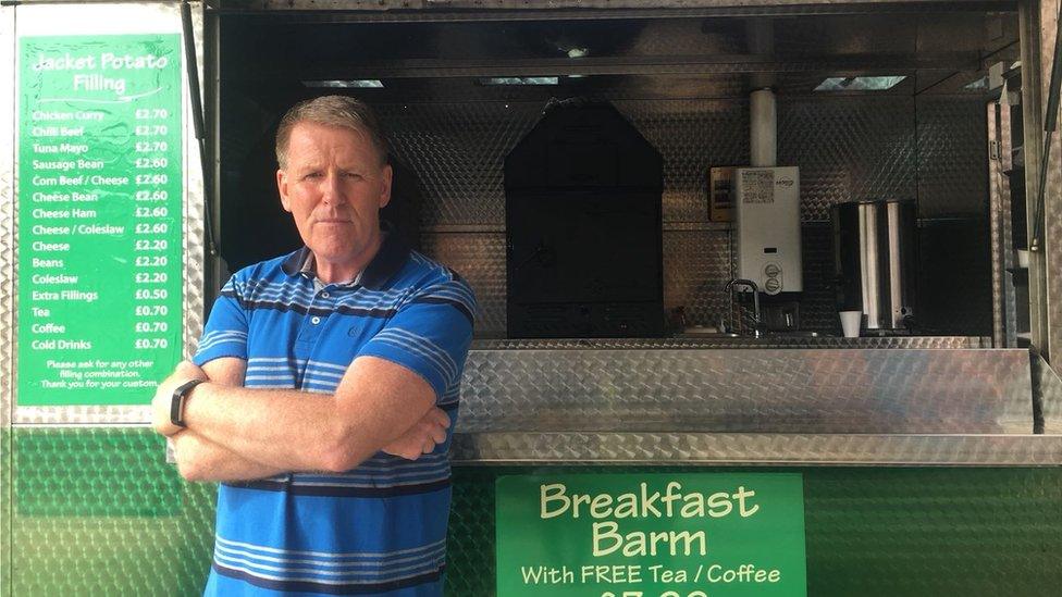 John Dickson in front of his potato van