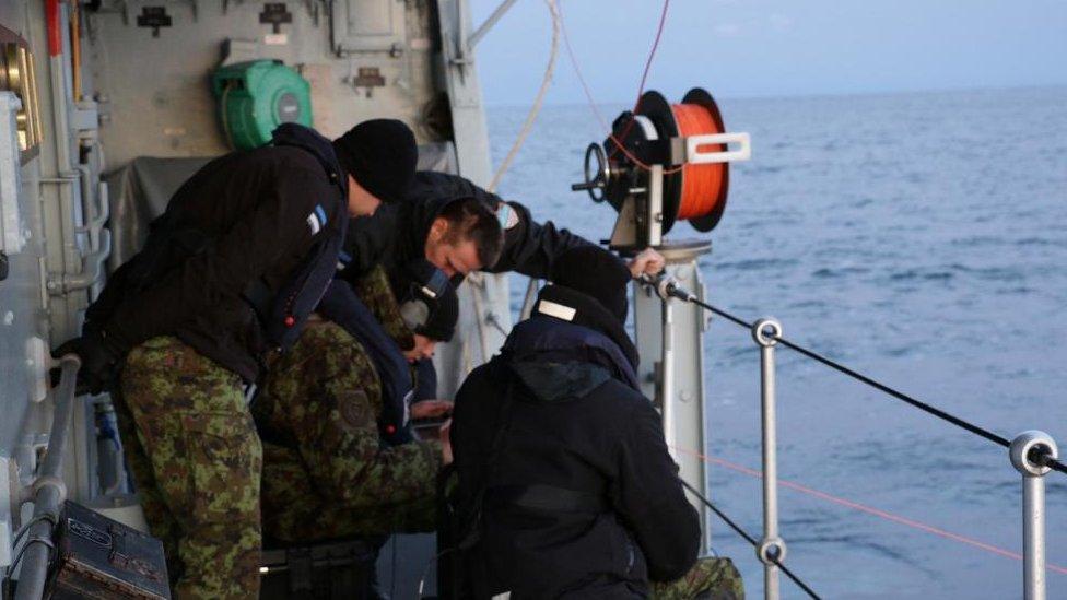 Estonian Navy sailors conduct an undersea communications cable survey after a pipeline and telecoms cable were damaged.