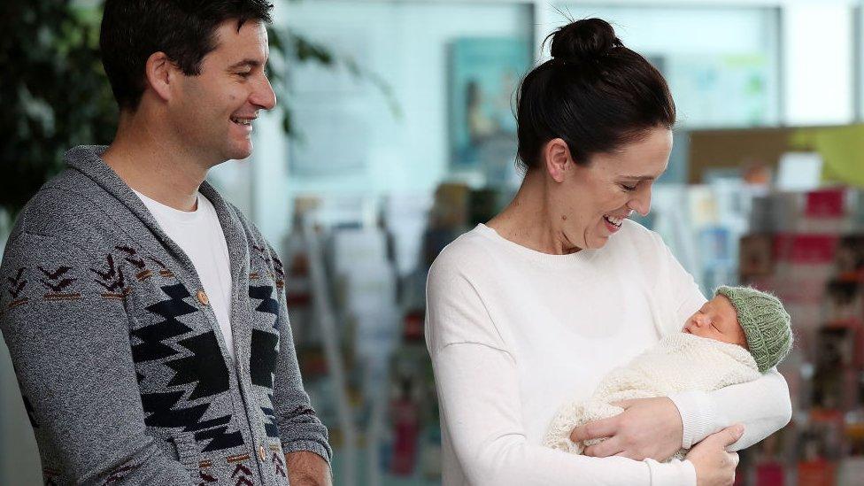 New Zealand Prime Minister Jacinda Ardern and partner Clarke Gayford pose for a photo with their new baby girl Neve Te Aroha