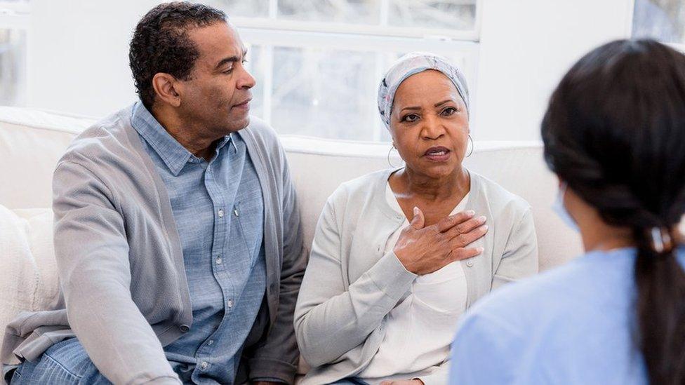 Couple talking to a doctor