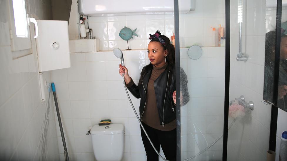 Jennifer Mbon in her bathroom