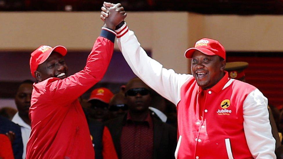 Kenya's President Uhuru Kenyatta (R) and his deputy William Ruto (L) greet as they salute supporters at the Kasarani stadium during the official launch of the Jubilee Party ahead of the 2017 general elections in Kenya's capital Nairobi on 10 September 2016.