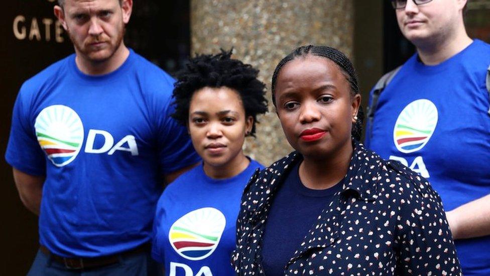 Phumzile Van Damme of the Democratic Alliance National speaks outside the Bell Pottinger offices in London