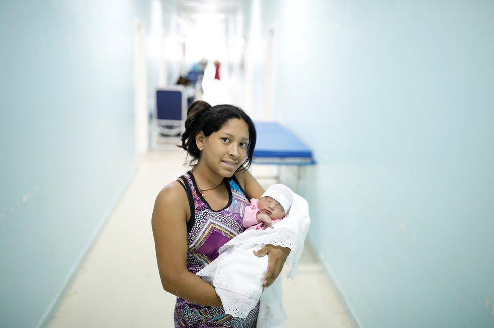 Cecilia, a Venezuelan woman holds her baby at a maternity hospital in Boa Vista,