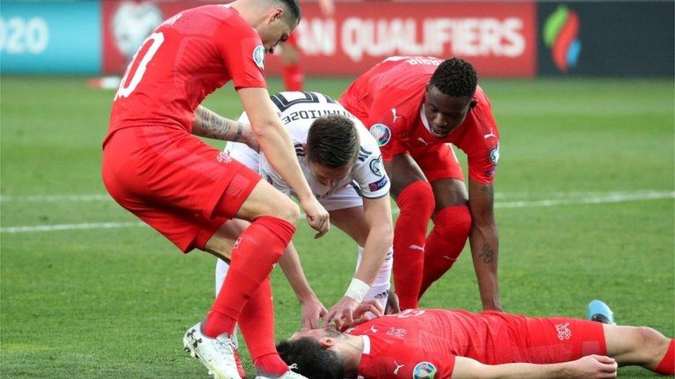 Switzerland's Fabian Schaer lies injured during the UEFA Euro 2020 qualifier against Georgia in Tbilisi, 23 March 2019