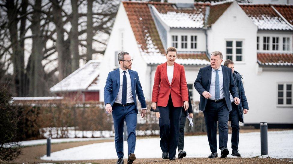 Coalition leaders Jakob Ellemann-Jensen of the Liberal Party, Prime Minister Mette Frederiksen of the Social Democrats and Lars Lokke Rasmussen of the Moderates