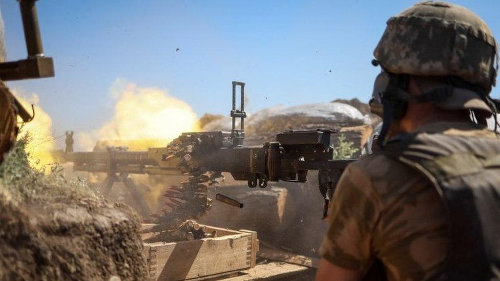 A Ukrainian soldier fires a machine gun. File photo