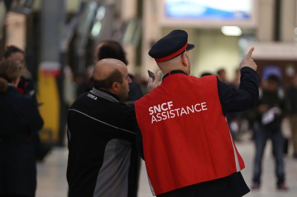 Passengers walk on a platform at the Gare de Lyon railway station on 1 June in Paris,