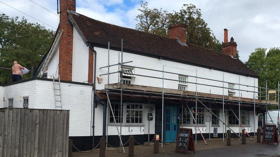 Scaffolding at the Black Boy pub to change the signage