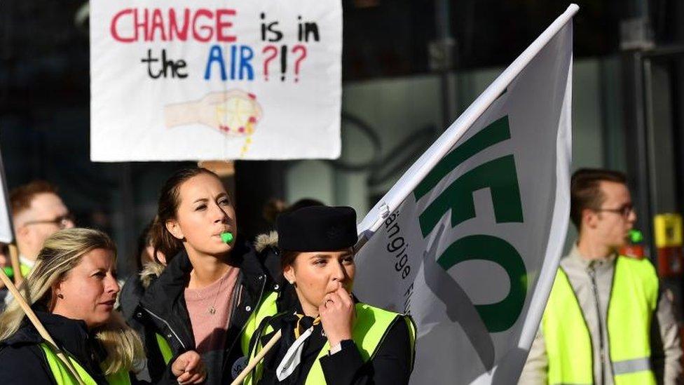 Flight attendants take part in a demonstration at an airport in Munich, Germany,