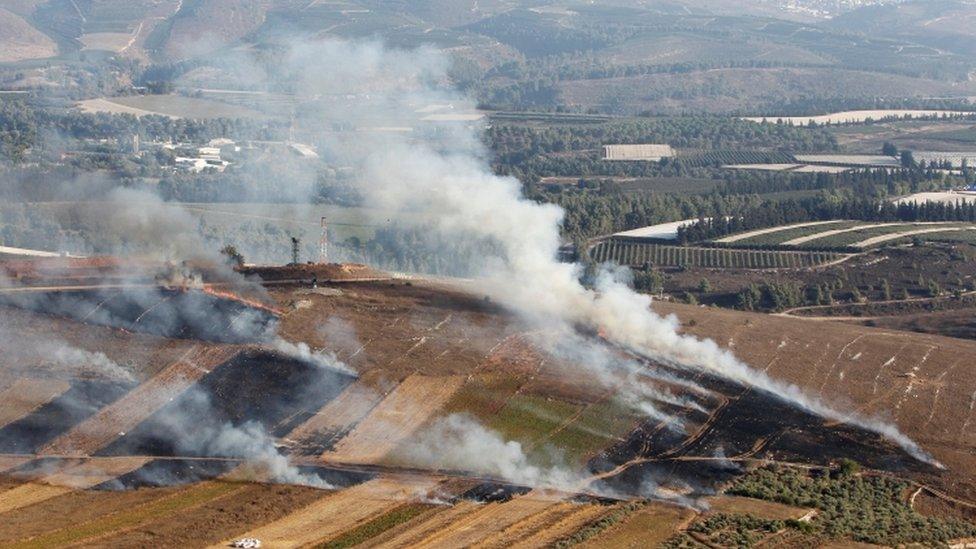 Smoke rises from shells fired from Israel in Maroun al-Ras village