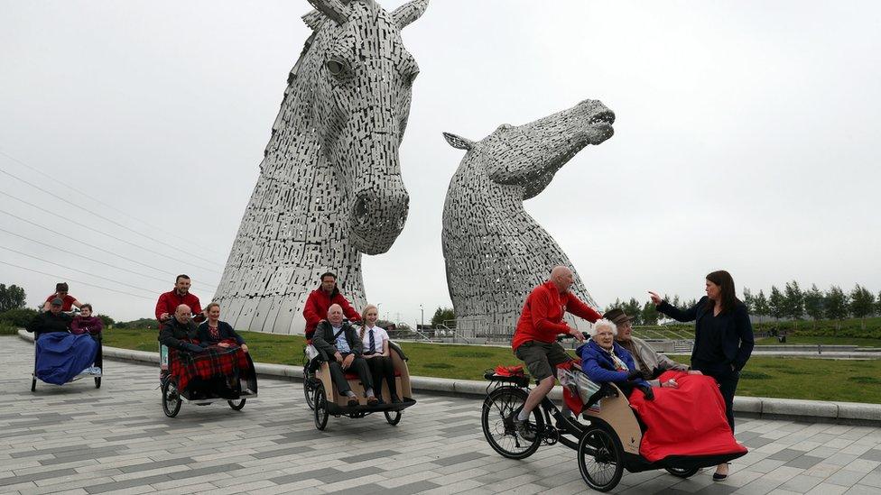 Public Health and Sport Minister Aileen Campbell (right) chats with with Mary Duncan, 90, Jim Taylor, 96, and volunteer Harry Wilson during the launch of Cycling Without Age Scotland at the Kelpies in Falkirk