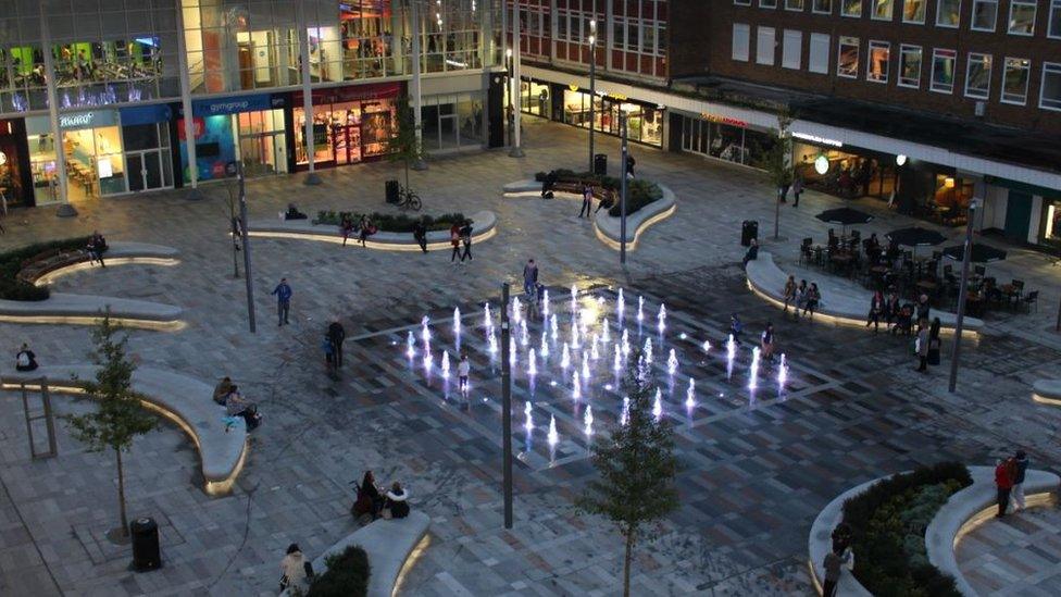 The Queens Square fountains in Crawley, lit up