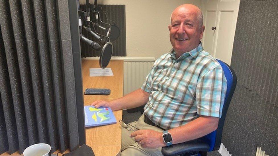 Volunteer Geraint Hughes recording one of the latest books